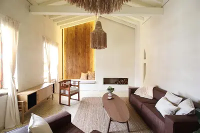 a living room with a couch and a table at Salina Casa de Huespedes in El Retiro