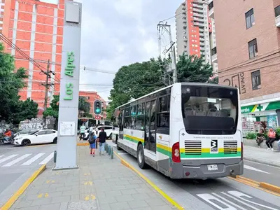 a bus parked on the side of a city street at Aparta estudio 103 - Casa bendita in Medellín