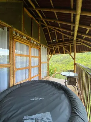 a room with a large mattress on a porch at Glamping Falan Tolima in Falan