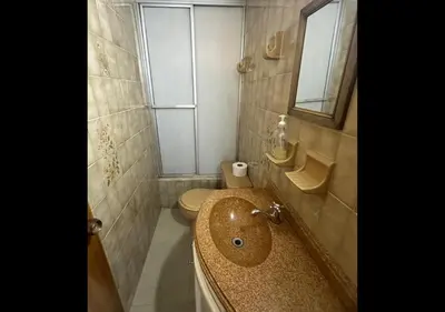 a bathroom with a sink and a toilet at Hospedaje Gladys in Manizales