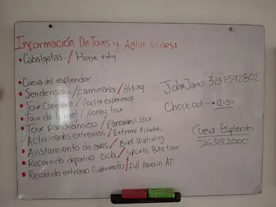 a white board with writing on it with a marker at Hostal Naty luna - sede alterna in Jardin