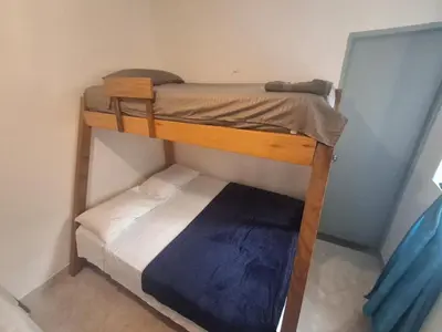 a couple of bunk beds in a room at Hostal Naty luna - sede alterna in Jardin