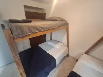 a couple of bunk beds in a room at Hostal Naty luna - sede alterna in Jardin