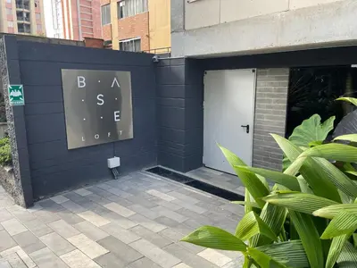 a black wall with a door with a sign on it at Medellín Apartment Loft in Medellín