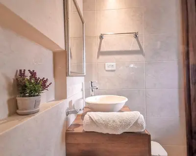 a bathroom with a white sink and a shower at Amazing view - Poblado in Medellín