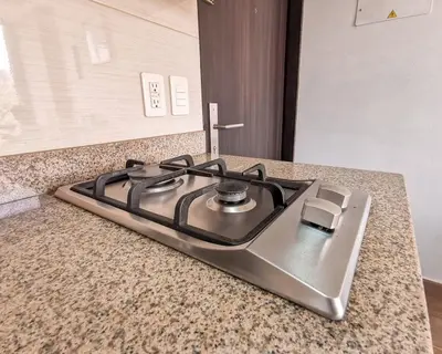 a stove top oven sitting on top of a counter at Amazing view - Poblado in Medellín