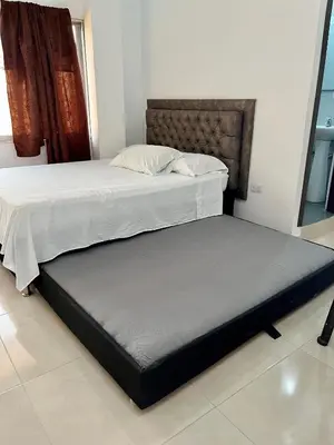 two beds sitting next to each other in a room at Habitación Central en Doradal 01 in Puerto Triunfo