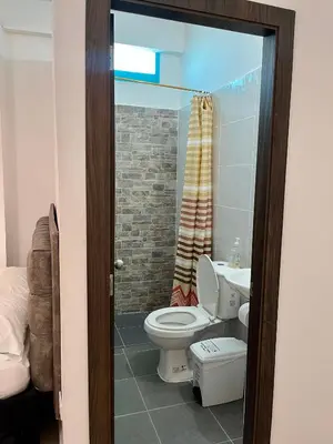 a bathroom with a toilet and a sink at Habitación Central en Doradal 01 in Puerto Triunfo