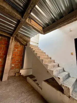 a staircase in a building with a metal roof at Habitación Central en Doradal 01 in Puerto Triunfo
