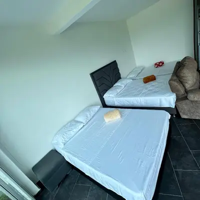 a room with two beds and a couch at XDfinca in Palermo