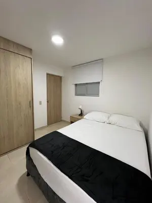 a bedroom with a large white bed in a room at Casa Eternal Comfort and Style in Envigado