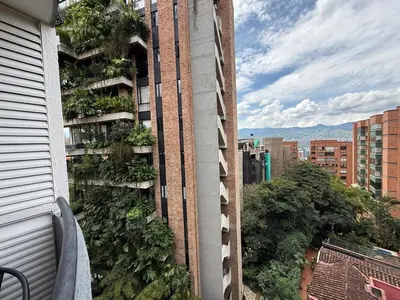 a view from a balcony of a building with plants at Ac, fast wifi 400 mg, quiet, nature in El Poblado in Medellín