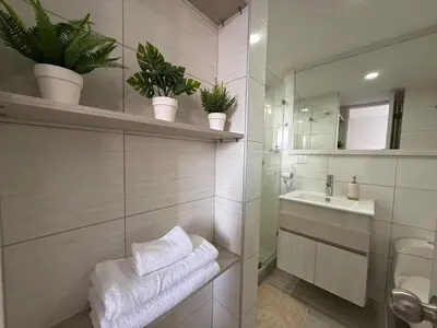 a bathroom with a sink and a mirror at Ac, fast wifi 400 mg, quiet, nature in El Poblado in Medellín