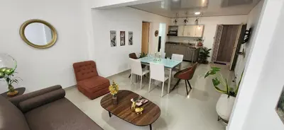 a living room with a couch and a table at Casa Laureles 2do Parque in Medellín