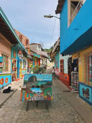 a painting on a table on a street at Suites del Lago in Marinilla