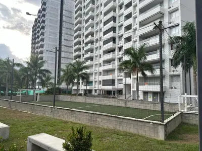 a tennis court in front of a large building at Beautiful Santa Fe de Antioquia DiSole apartment in Santa Fe de Antioquia