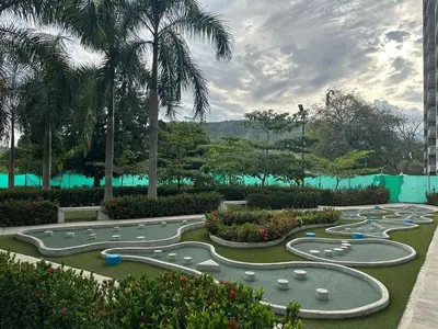 a golf course with a bunch of golf carts at Beautiful Santa Fe de Antioquia DiSole apartment in Santa Fe de Antioquia