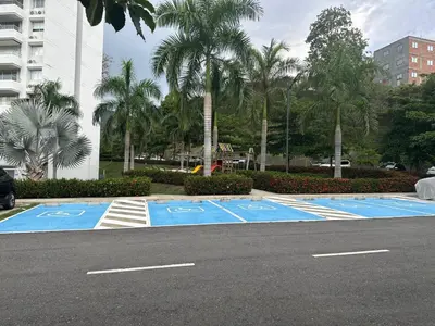 an empty parking lot with blue lanes on a street at Beautiful Santa Fe de Antioquia DiSole apartment in Santa Fe de Antioquia