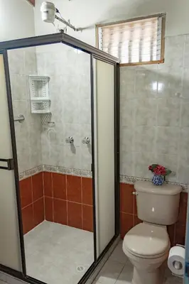 a bathroom with a shower and a toilet at Hotel Casa Encanto Jardín in Jardin
