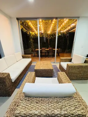 a living room with couches and a table with lights at Finca de lujo con picsina en San Jerónimo Antioquia in San Jerónimo