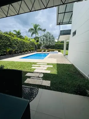 an external view of a house with a swimming pool at Finca de lujo con picsina en San Jerónimo Antioquia in San Jerónimo