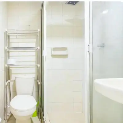 a bathroom with a toilet and a sink and a shower at Casa La Palma Habitación Altillo in Medellín
