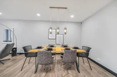 a dining room with a table and chairs at Moderno-Central El Poblado Apartamento in Medellín