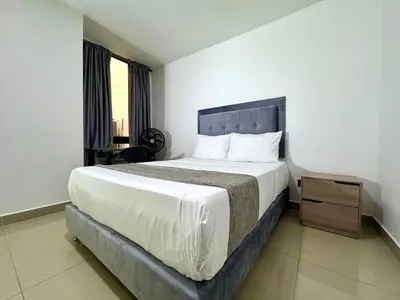 a bedroom with a large bed and a window at Praga Room Unicentro in Medellín