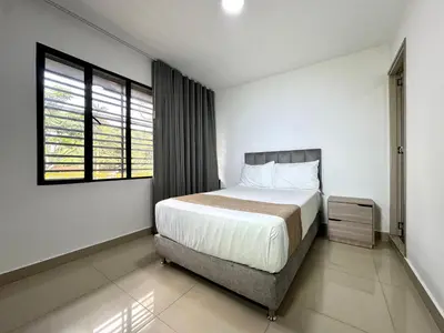 a bedroom with a large bed and a window at Praga Room Unicentro in Medellín