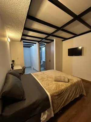 a bedroom with a large bed in a room at Lujoso, relajante y Cómodo Apartaestudio en La Rambla in Manizales