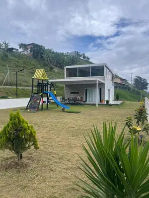 a house with a playground in a yard at Hermosa Casa de descanso Villa María in Don Matías