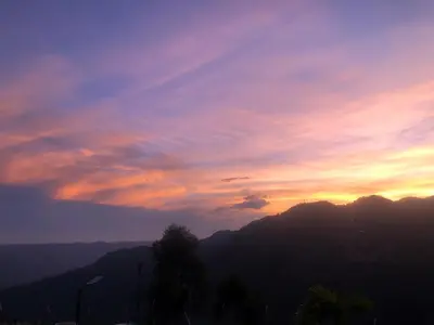 a sunset with a view of a mountain at Hermosa Casa de descanso Villa María in Don Matías
