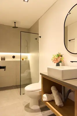 a bathroom with a sink and a toilet and a mirror at Cozy Stadio Escape Rosa Negra Stay in Medellín