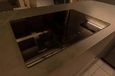 an oven with a cross on top of a counter at Vive Pisoverde - a Loft with a green soul in Medellín