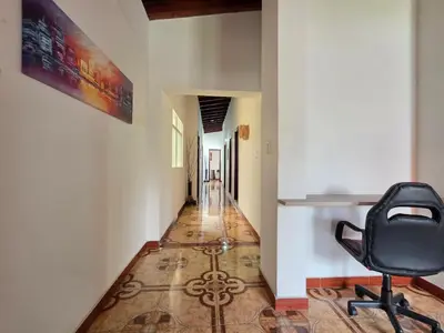 an office with a chair in a hallway at 5StarHomes - Casa privada cerca al Estadio y la 70 in Medellín