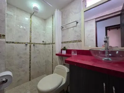 a bathroom with a sink and a shower at 5StarHomes - Casa privada cerca al Estadio y la 70 in Medellín