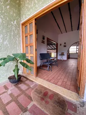 an open door to a room with a potted plant at Finca Villa Juan Pablo in Anserma