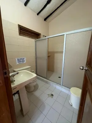 a bathroom with a shower and a toilet and a sink at Finca Villa Juan Pablo in Anserma