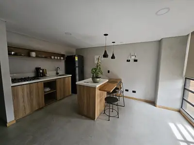 a kitchen with a island in the middle of a room at 2402 Luxury apartment in Sabaneta in Sabaneta