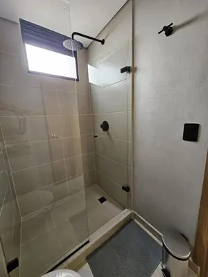 a bathroom with a shower with a glass door at 2404 Luxurious apartment with Jacuzzi in Sabaneta
