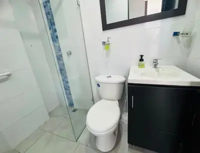 a bathroom with a toilet and a sink and a shower at Apartaestudio de 2 habitaciones cerca a provenza y el tesoro in Medellín
