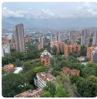 a view of a city with tall buildings and trees at Apartaestudio de 2 habitaciones cerca a provenza y el tesoro in Medellín