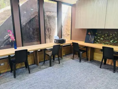 a conference room with a long wooden table and chairs at Apartaestudio de 2 habitaciones cerca a provenza y el tesoro in Medellín