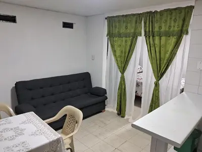 a living room with a couch and a table at Confortable Apartamento Parque Caldas Manizales in Manizales