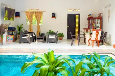 a patio with chairs and a swimming pool at Casa Bella in Honda