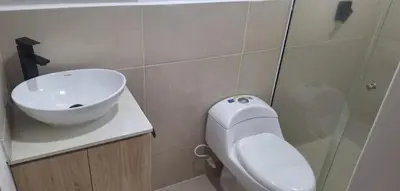 a bathroom with a sink and a toilet and a shower at Espacio en Medellin, Ideal para tu estilo de vida moderno, estrátegico y cómodo in Medellín