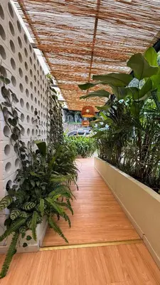 a hallway with plants in a building with a ceiling at Suite con jacuzzi en El Poblado in Medellín