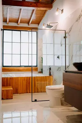 a bathroom with a shower and a toilet and a tub at Suite con jacuzzi en El Poblado in Medellín