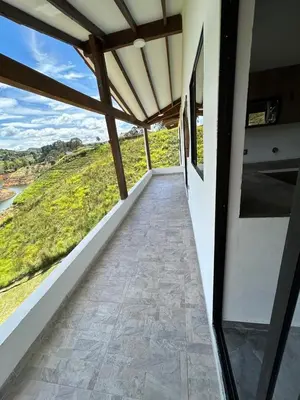 a view from the balcony of a house at Espectacular vista a la represa el peñol in La Pradera