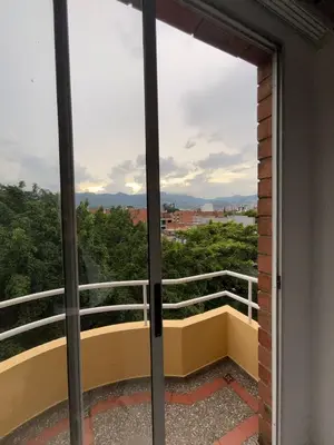 a sliding glass door with a view of a balcony at Hermoso apartamento para disfrutar su estadía in Medellín